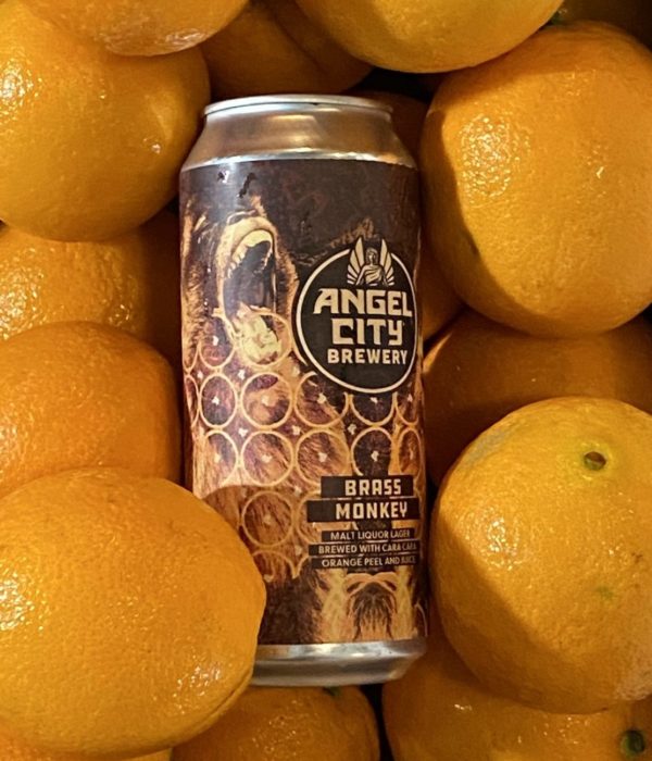 16oz. Can of Brass Monkey Malt Liquor Lager in a box of Cara Cara Oranges