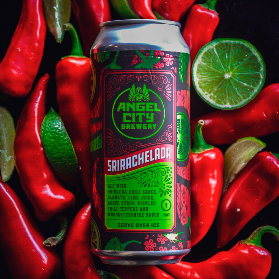 A 16oz can of Srirachelada on a bed of Fresno Chili Peppers and Limes