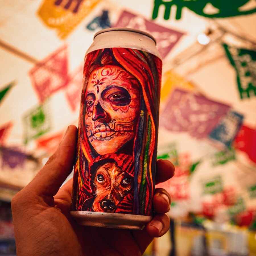 A can of Olvera St. Mexican Lager featuring art by Elisa Torres