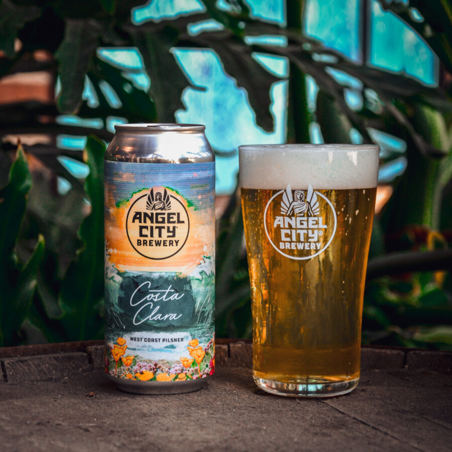 A 16oz. can of Costa Clara West Coast Pilsner next to a pint glass of the same beer