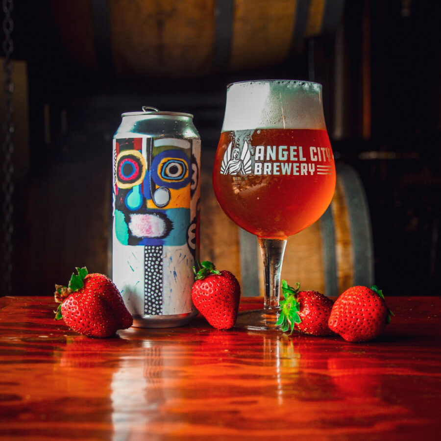 A can of Angel City Brewery's Strawberry Gose next to a pint of the same beer. Can art by local artist Alli Conrad, curated by ArtShare LA
