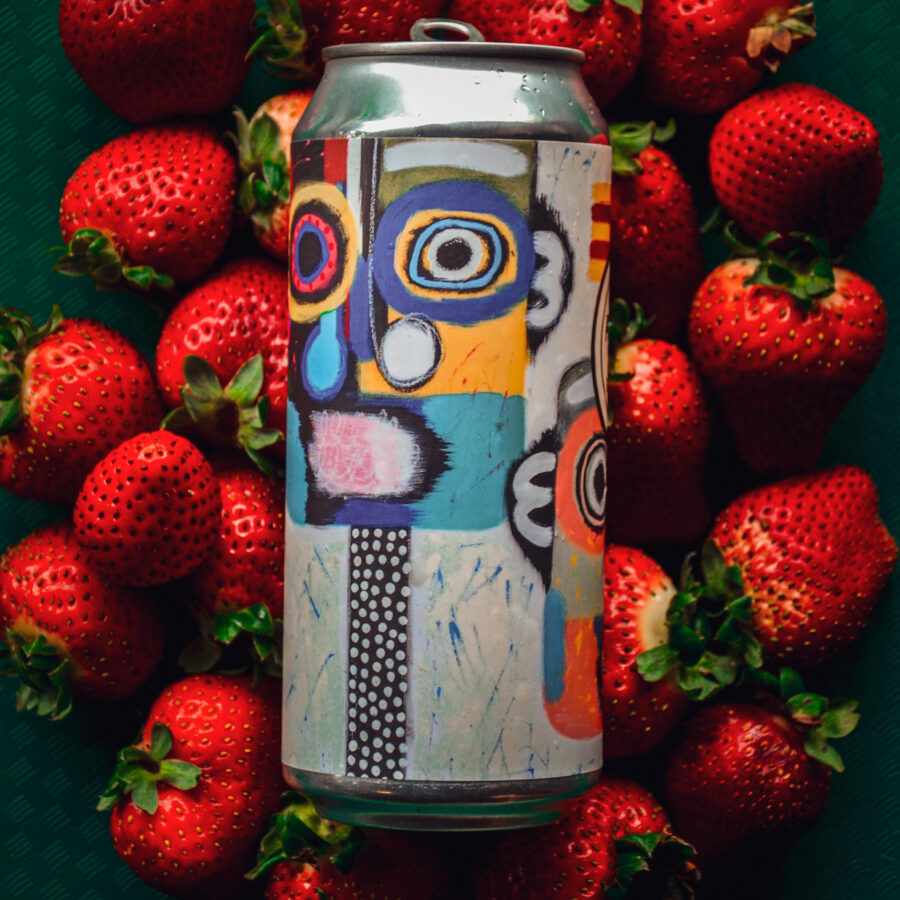 1 16oz. Can of Angel City Brewery's Strawberry Gose laying on a bed of strawberries, featuring can art by local artist Alli Conrad - curated by ArtShare LA
